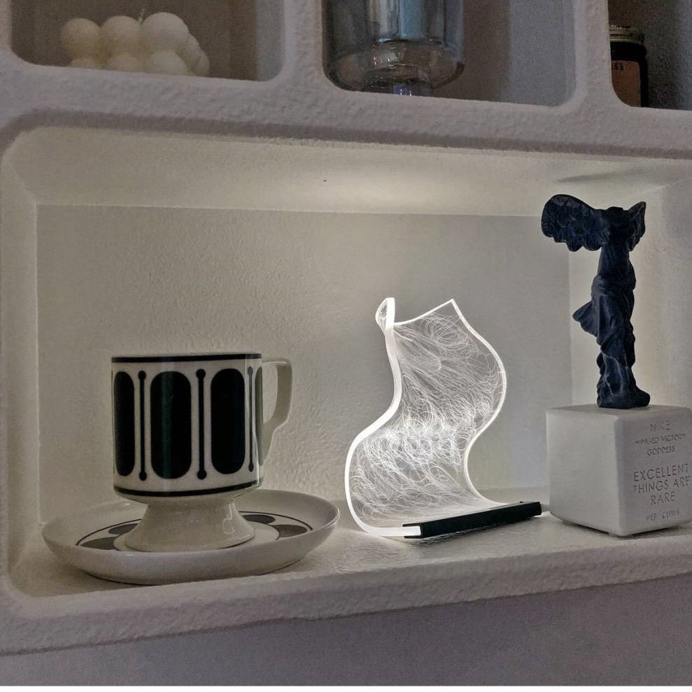 small lamp-small nightstand-soft illumination-warm glow